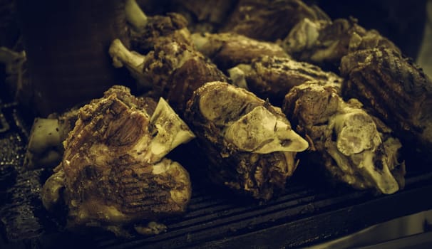 Meat on the grill, roasting meat on an ember with fire