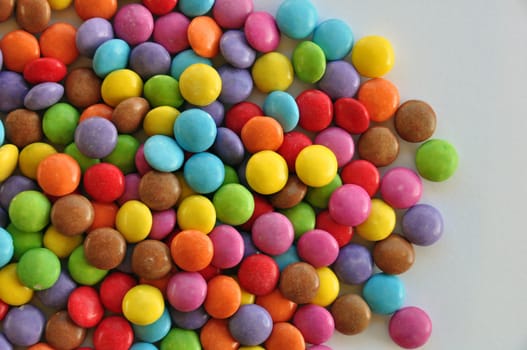 Colorful candy on white background. Chocolate snack.