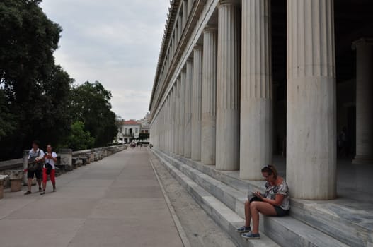 ATHENS, GREECE - SEPTEMBER 2, 2014: People at stoa of attalos in the ancient agora.