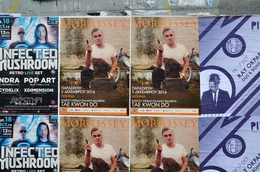 ATHENS, GREECE - OCTOBER 15, 2014: Wall with live music concert posters indie rock by Morrissey and dj sets of minimal techno by Ray Okpara and psychedelic trance by Infected Mushroom.