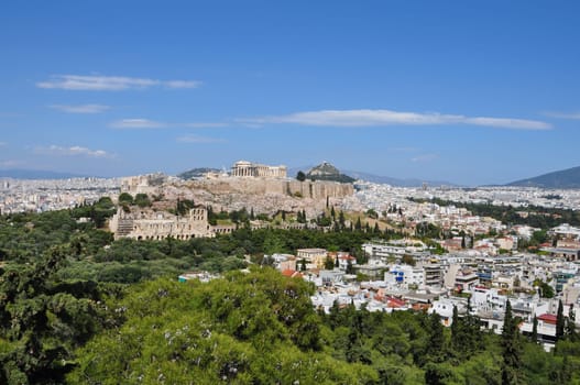 Panoramic view of Athens Greece city buildings and ancient landmarks Acropolis and Odeon of Herodes Atticus.