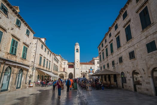 Dubrovnik, Croatia - April 2018 : Tourists walking, sightseeing or sitting in restaurants in the Dubrovnik Old Town