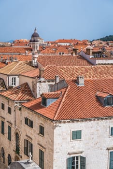 Dubrovnik, Croatia - April 2018 : Church bell tower dome and rooftops of old houses in Dubrovnik, viewed from the Old Town fortified walls