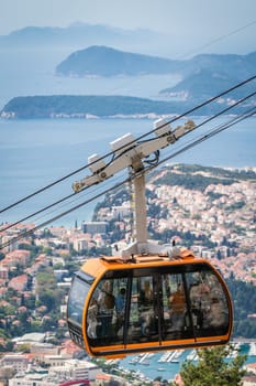 Dubrovnik, Croatia - April 2018 : Dubrovnik cable car, a popular tourist attraction taking people on the top of a Mount Srd above the historical Old Town Walls