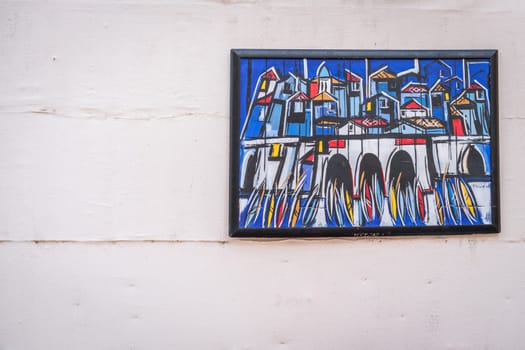 Dubrovnik, Croatia - April 2018 : Colorful painting on the white wall depicting marina in the Old Town Dubrovnik