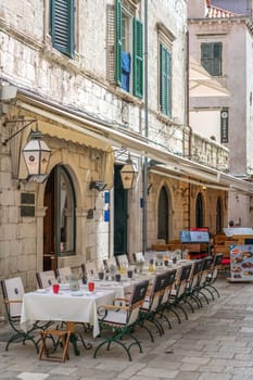 Dubrovnik, Croatia - April 2018 : Customer tables set up and ready for food service outside one of popular restaurants in Dubrovnik Old Town