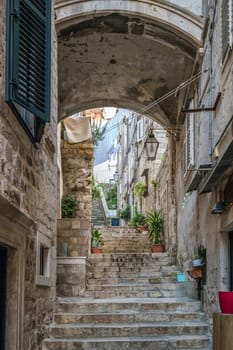 Dubrovnik, Croatia - April 2018 : Steps on the steep narrow street passage between residential buildings in the Dubrovnik Old Town