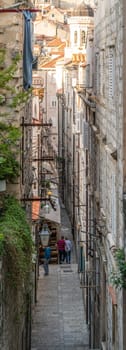 Dubrovnik, Croatia - April 2018 : Steps on the steep narrow street passage between residential buildings in the Dubrovnik Old Town