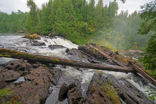 Looking over the Brink of Silver Falls in Quetico Provincial Park in Ontario
