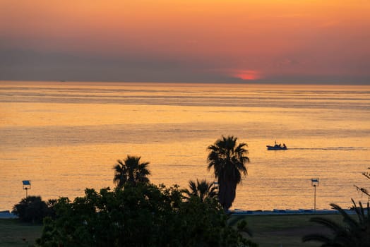 Small fishing boat and seascape just before sunrise in Palermo, Italy