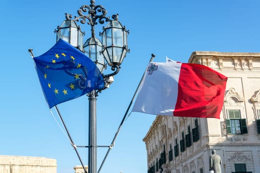 Maltese flag flying side by side with the European Union flag in Valletta, Malta