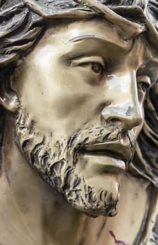 Bronze statue of the face of jesus. Ancient sculpture. Ideal for concepts or events like Easter.