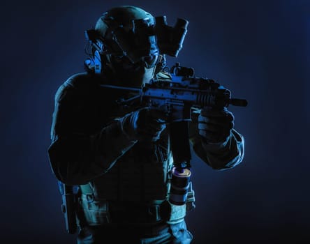 Army special operations squad soldier, police counter terrorism assault team member, security service rifleman in mask, helmet with headset and night vision device, armed short barrel service rifle