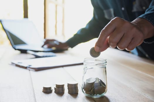 Hand drop a coin with money coin stack growing for business. financial and accounting concept.