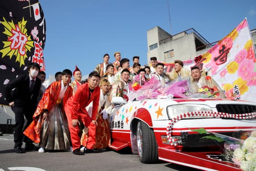 KAGAWA, JAPAN - JANUARY 13, 2019: Young Japanese men wearing traditional kimono for the coming of age day celebration, they turn twenty (seijinsiki, seijinshiki) in Kagawa, Japan.