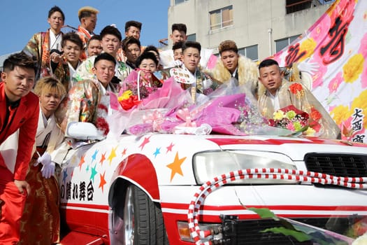 KAGAWA, JAPAN - JANUARY 13, 2019: Young Japanese men wearing traditional kimono for the coming of age day celebration, they turn twenty (seijinsiki, seijinshiki) in Kagawa, Japan.
