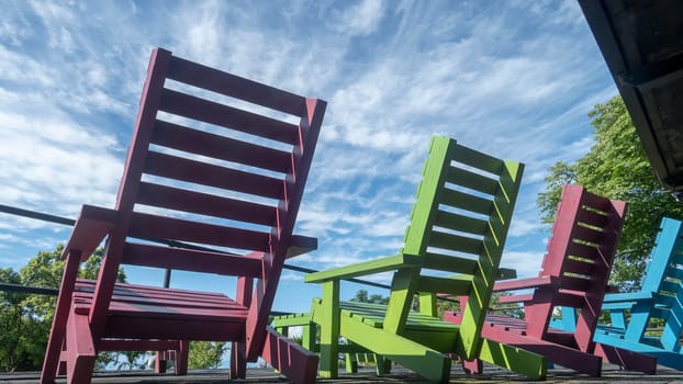 The colorful chair wit very nice blue sky wit cloud