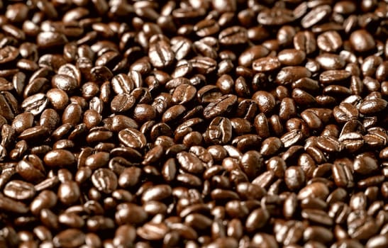 Roasted coffee beans on a flat background textured