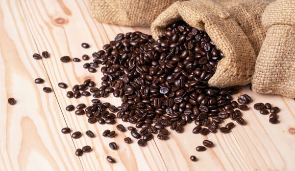 Coffee beans spilled out from burlap sack