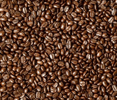 Roasted coffee beans on a flat background textured