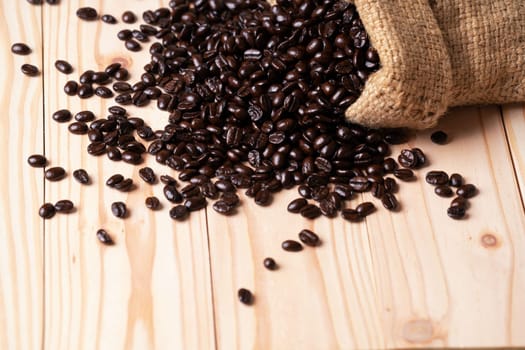 Coffee beans spilled out from burlap sack