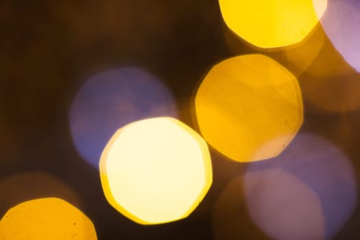 large gold and silver bokeh on a dark background.