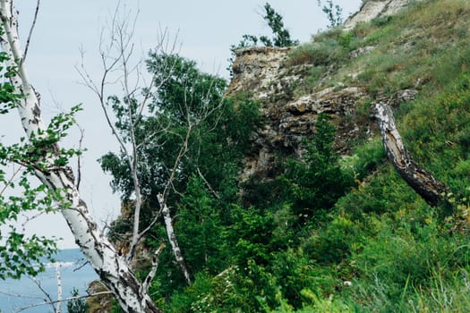 landscape river cliff grass on the sky background.
