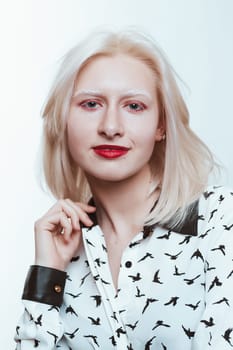 portrait blonde albino girl in studio on white background.