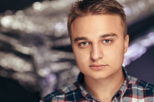 portrait of a young man on a blurred background.