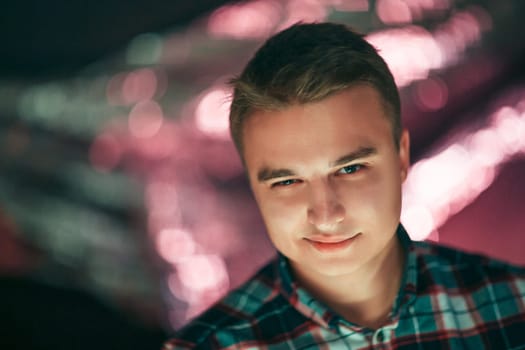 portrait of a young man on a blurred background.