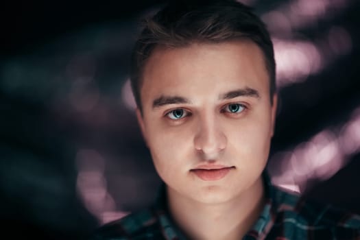 portrait of a young man on a blurred background.