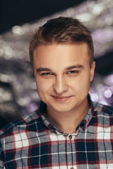 portrait of a young man on a blurred background.