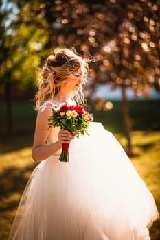 beautiful young bride in the garden background.