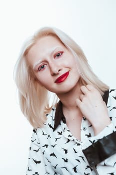 portrait blonde albino girl in studio on white background.
