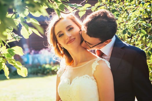 bride and groom on background summer forest.