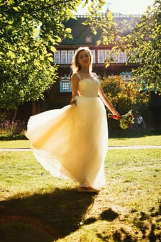 beautiful young bride in the garden background.