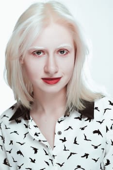 portrait of blonde albino girl in studio.
