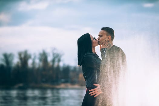 man and woman near the river autumn.