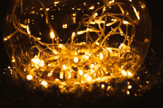Christmas luminous garland on a dark background.