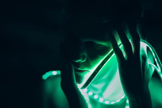 Portrait man Strip Light LED tape on dark color background.