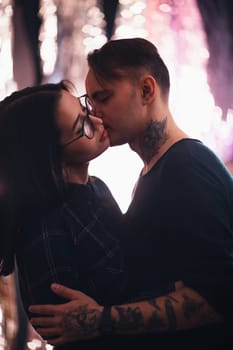 guy and the girl kiss closeup on a light background