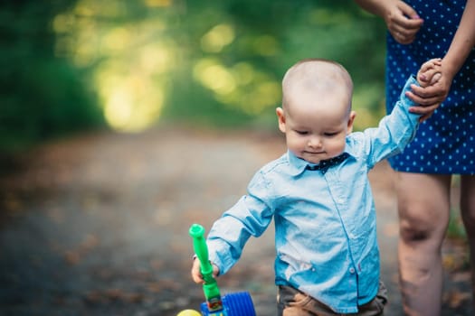 happy mother and toddler son on nature background.