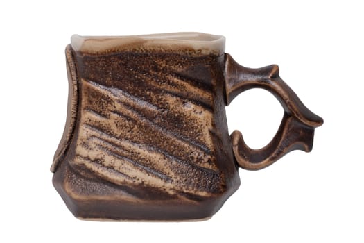 A brown clay mug isolated on a white background. Round cirle space for design. Macro.