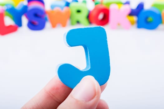 Letter cube of J of  Alphabet made of wood