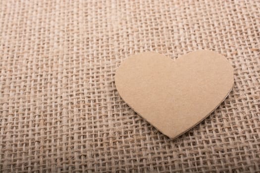 Heart shaped object on a canvas background