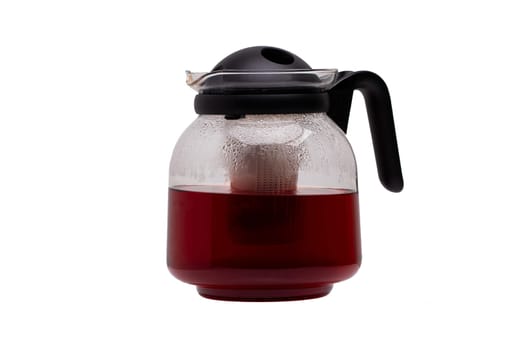 Teapot isolated.  Glass tea maker with a detachable plastic infuser isolated on a white background. Microwave glass jug with tea filter insert.