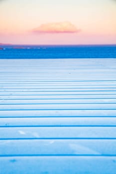white wooden planks, sunset sky. sea