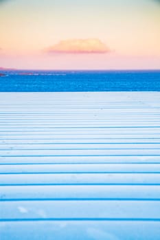 white wooden planks, sunset sky. sea