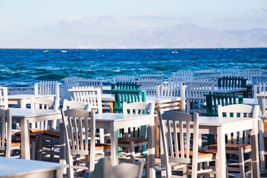 restaurant chairs and tables by the sea