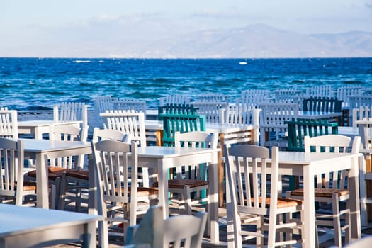 restaurant chairs and tables by the sea